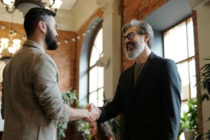 Smiling businessmen shaking hands