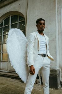 A man wearing an angel costume
