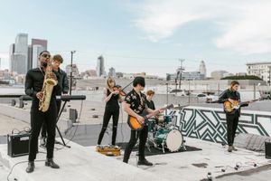 A jazz band playing on a rooftop stage