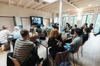 Group of people listening intently to a presentation
