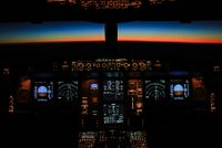 Two pilots sitting a plane cockpit