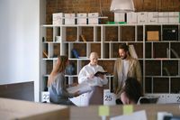 Focused colleagues having briefing in an office